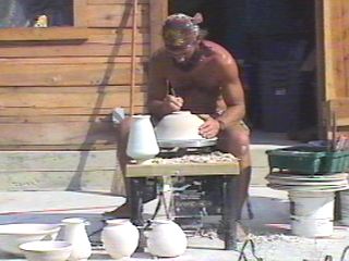 Potter Trimming a Bowl at the Pottery